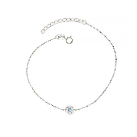 925 Sterling Silver rhodium plated bracelet with flower design, white cubic zirconia and one light blue in the center