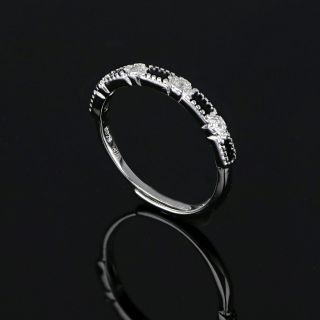 Ασημένιο δαχτυλίδι με μαύρα και λευκά ζιργκόν - 
