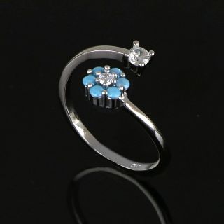 925 Sterling Silver ring with white cubic zirconia and a flower with white blue cubic zirconia and light blue stones - 