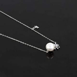 925 Sterling Silver rhodium plated necklace with a white fresh water pearl in the center and two charms - 