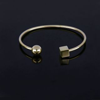 Stainless steel gold plated bangle with geometric shapes - 