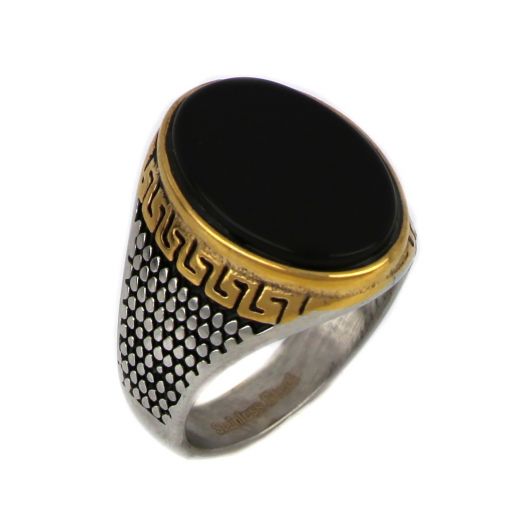 Ring made of stainless steel with gold plated meander embossed design and black stone.