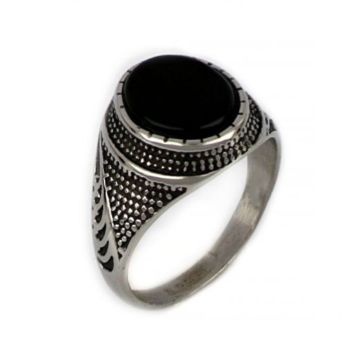 Ring made of stainless steel with embossed design and black stone.