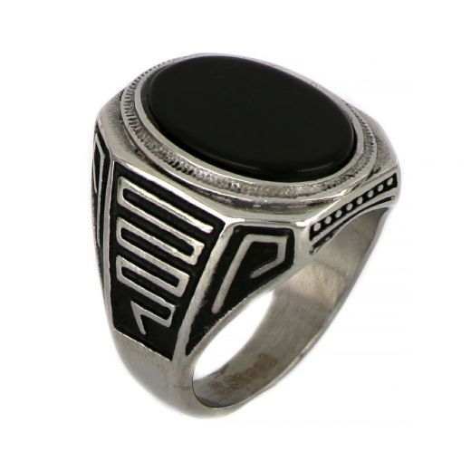 Ring made of stainless steel with embossed meander design and black stone.