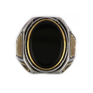 Ring made of stainless steel with gold plated meander and black stone. - 