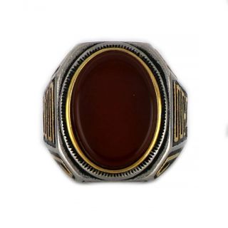 Ring made of stainless steel with gold plated meander and carnelian stone. - 