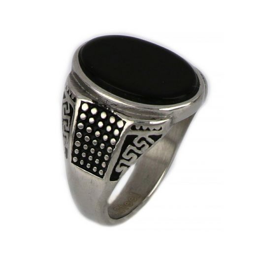 Ring made of stainless steel with discreet meander to the sides and black stone.