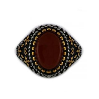 Ring made of stainless steel with gold plated details and carnelian stone. - 