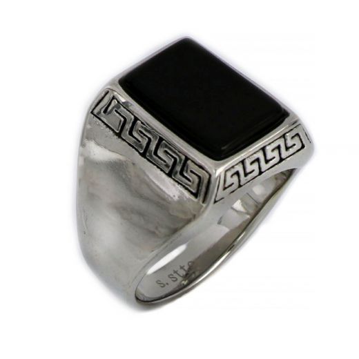 Ring made of stainless steel with discreet meander design and black stone.