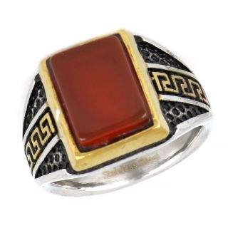 Ring made of stainless steel with embossed gold plated meander to the sides and carnelian stone. - 