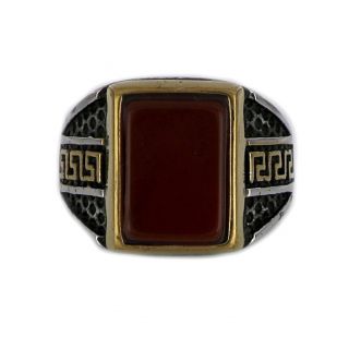 Ring made of stainless steel with embossed gold plated meander to the sides and carnelian stone. - 