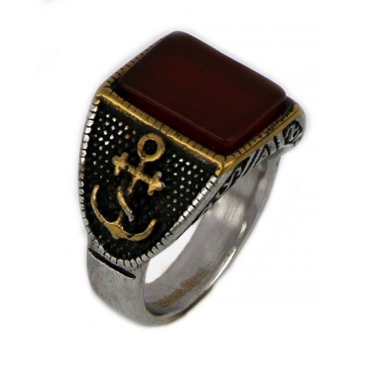 Ring made of stainless steel with embossed gold plated anchor design to the sides and carnelian stone.