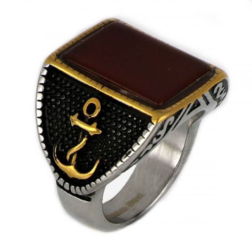 Ring made of stainless steel with two gold plated anchors to the sides and carnelian stone.