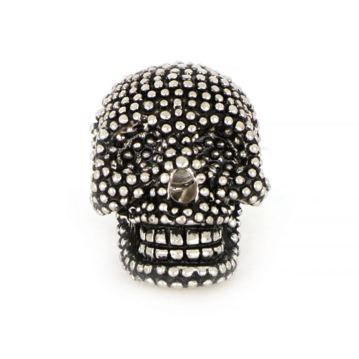 Lapel pin in skull shape.