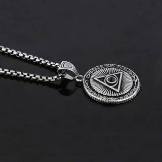 Pendant made of stainless steel with round element with an embossed Egyptian eye and chain. - 