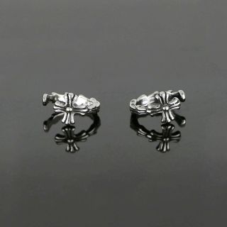Unisex stainless steel non pierced earrings with embossed cross - 