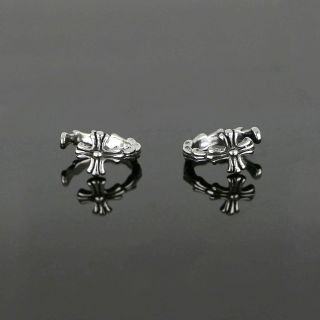Unisex stainless steel non pierced earrings with embossed cross - 