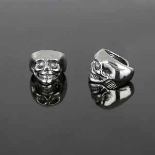 Unisex stainless steel non pierced earrings with embossed skull - 