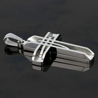 Cross made of stainless steel with embossed lines. - 