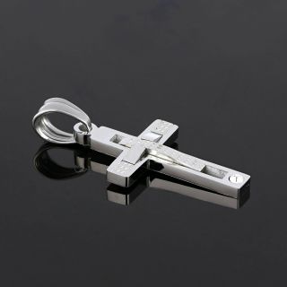 Cross made of stainless steel with a small embossed cross and one cubic zirconia. - 