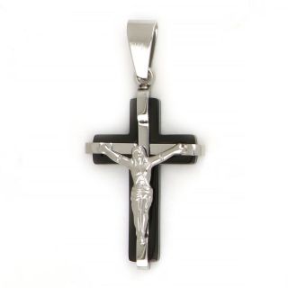 Black cross made of stainless steel with the Crucified Christ as white embossed design Black cross made of stainless steel with the Crucified Christ as white embossed design